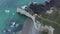 Wide Establishing Shot of Cliff Shoreline and Ruff Ocean Waves, Etretat Cliffs in France