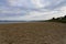 The wide expanse of Llanbedrog beach on a summer evening