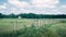 Wide fence, field, and farmhouse