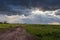 Wide meadows and rain clouds