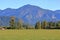 Wide Open Farmland and Steep Mountain