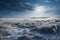 A wide open frost prairie bathed in rays of setting sun. Endless snow-covered steppe, dry plants sticking out from under the snow