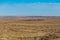 Wide open high desert landscape with brush and clear skies in rural New Mexico