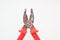 Wide open rusty red pliers