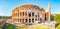 Wide outside panorama of Colosseum or Coliseum, known as the Flavian Amphitheatre, is an oval amphitheatre in the center of the