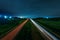 Wide overhead view of car light trails on a national motorway