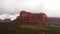 Wide panning drone shot of red rocks and canyons in Sedona, Arizona