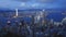 A wide panning shot at dusk from the peak lookout in hong kong