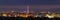 Wide panorama, aerial night view of modern tourist Ivano-Frankivsk city, Ukraine. Scene of bright lights of tall buildings, high t