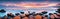 Wide panorama of beautiful sunset over calm sea. Sunrise over the sea. Web banner or print. Vacation holiday concept background.