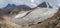 Wide panorama of the big glacier, high in the mountains, covered by snow and ice. Altai winter landscape