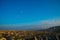 Wide panorama of Cappadocia landscape - colored balloons flying over mountain peaks and fantastic valley. Air balloons above