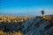 Wide panorama of Cappadocia landscape - colored balloons flying over mountain peaks and fantastic valley. Air balloons above