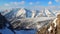Wide panorama of grand snowy rocky mountain ridge, Austrian Alps