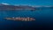 Wide panorama of Isola Superiore on lago Maggiora in italy on a beautiful sunny winter day. Majestic mountains with snow visible