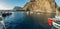 Wide panorama of Playa De Vueltas beach and Port with yacht and fishing boats at the atlantic ocean in La Gomera. A popular