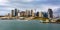 Wide panoramic view across the harbor of Sydney`s iconic city skyline and downtown central business district in Australia