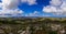 Wide panoramic view of the island of Crete in Greece. Landscape with a view of a water quarry, mountains and blue sky in