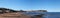 Wide panoramic view of town of Scarborough from the beach on the south bay in summer sunlight