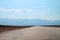 Wide path extending into open salt flat in California