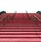 Wide red staircase qith green rails