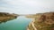 Wide river among the green canyon. Large green hills and steppe.