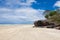 Wide sandy beach on Fraser Island, East Australia. Tire tracks of cars in the sand 