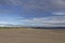 The wide sandy deserted beach of Tentsmuir Point on the southern edge of the Tay Estuary, looking North towards Broughty Ferry.