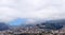 Wide scenic panoramic aerial cityscape of the city of funchal in Madeira with buildings of the city in front of mountains with