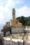 Wide shoot of beautiful yellow facade lighthouse church at Portofino, Italy