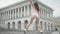 Wide shot of beautiful twerk dancer performing outdoors on city square. Portrait of cheerful brunette Caucasian woman