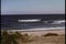 Wide shot boat sailing towards shore