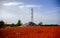 Wide shot of a construction site with a pile of gravels on the ground with telecommunication tower on the background