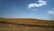 Wide shot of a freshly cleared farmland