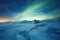 a wide shot of frozen tundra under aurora lights