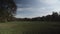 Wide shot of a large meadow on a Sunny autumn fall day in Berlin Public Park Hasenheide. Colourful Leaves are slowly