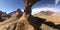 Wide shot of the Namibia Spitzkoppe Bridge under a blue cloudy sky