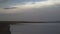 Wide shot of a peaceful Mongolian lake in the early morning hours.