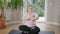 Wide shot portrait of beautiful plump Caucasian yogi meditating sitting in lotus pose on exercise mat. Confident young