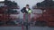 Wide shot portrait of frustrated sad Caucasian man in suit trying uniform standing at warehouse outdoors. Unsuccessful