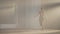 Wide shot portrait of graceful slim ballerina rehearsing performance in front of mirror in dancing studio backlit fog