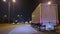 Wide shot POV Driving view. A FEDEX Truck delivers parcels, highway night time. Naperville IL. USA 18 sept 2023