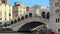 Wide shot revealing The Rialto Bridge over The Grand Canal, Venice, Italy