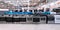 Wide shot of Rows of various stove top ovens lined up at an appliance store showroom