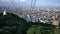 wide shot of sapporro city from a cable car going up mountain moiwa, hokkaido, japan