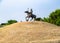 Wide shot of Sikh Warrior statue on horse in war memorial garden under the sky. historical concept