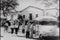 Wide shot of students boarding school bus