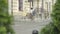 Wide shot of three cheerful women walking to fashion shop on sunny summer day. Portrait of confident mid-adult Caucasian