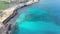 Wide shot of turquoise sea lagoon on Cyprus resort. Aerial view of transparent water of Mediterranean Sea with stones at