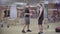 Wide shot of two body-builders talking in gym. Strong Caucasian sportsmen standing in sports club and talking. Handsome